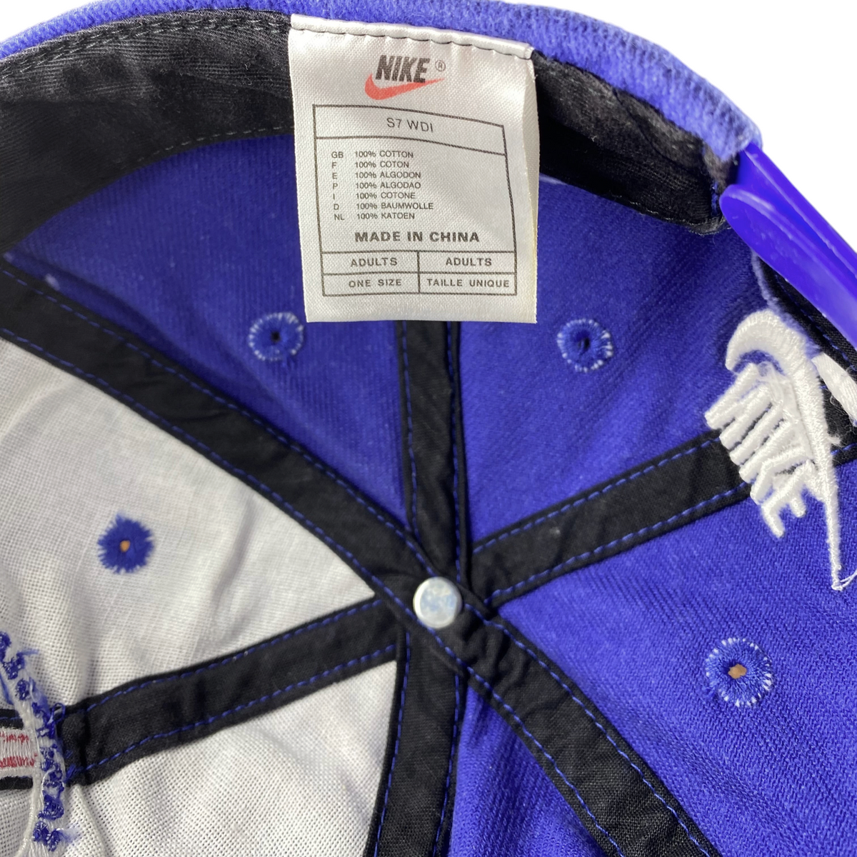 Digg It Thrift & Vintage Nike x Paris Saint-Germain snapback cap interior showing cotton tag and blue fabric