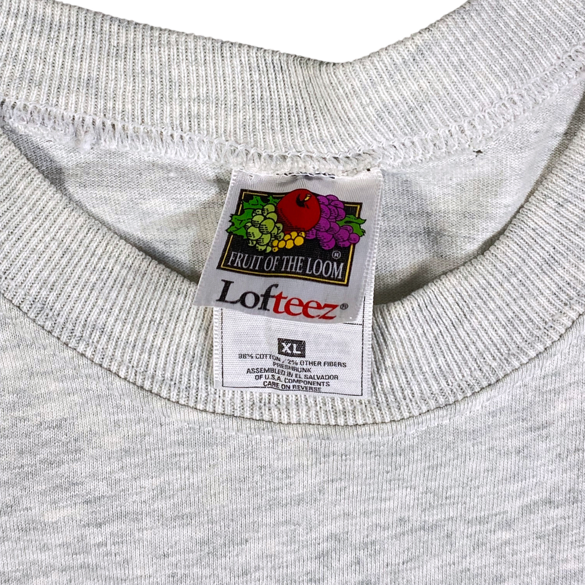 Digg It Thrift & Vintage grey Fruit of the Loom Lofteez t-shirt tag showing XL size and cotton blend fabric
