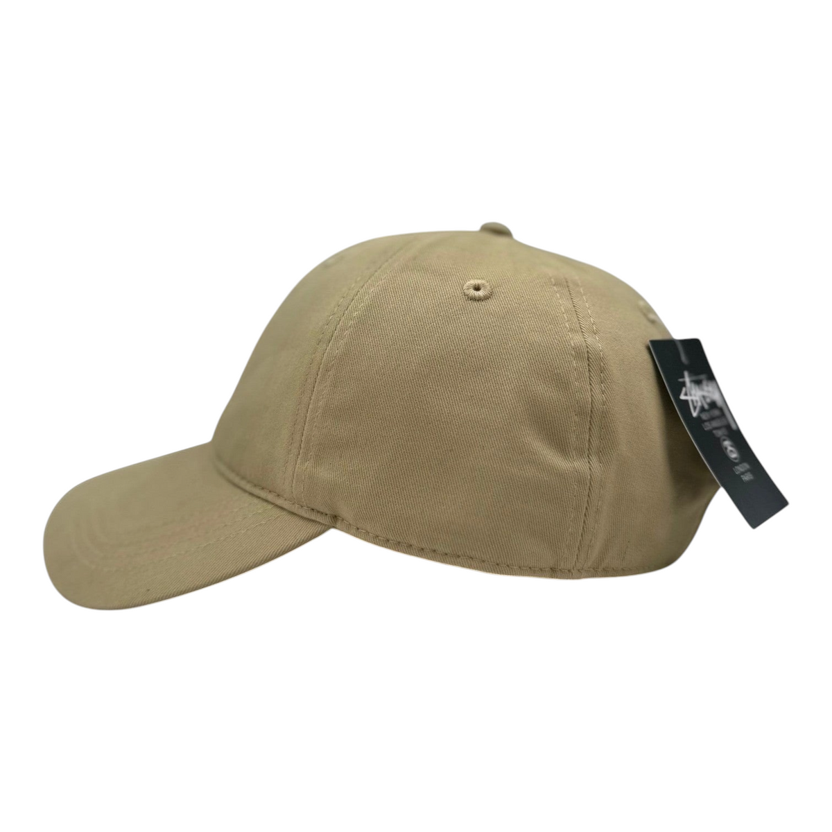 Digg It Thrift & Vintage beige Stussy cotton twill cap with black logo embroidery, side profile view.