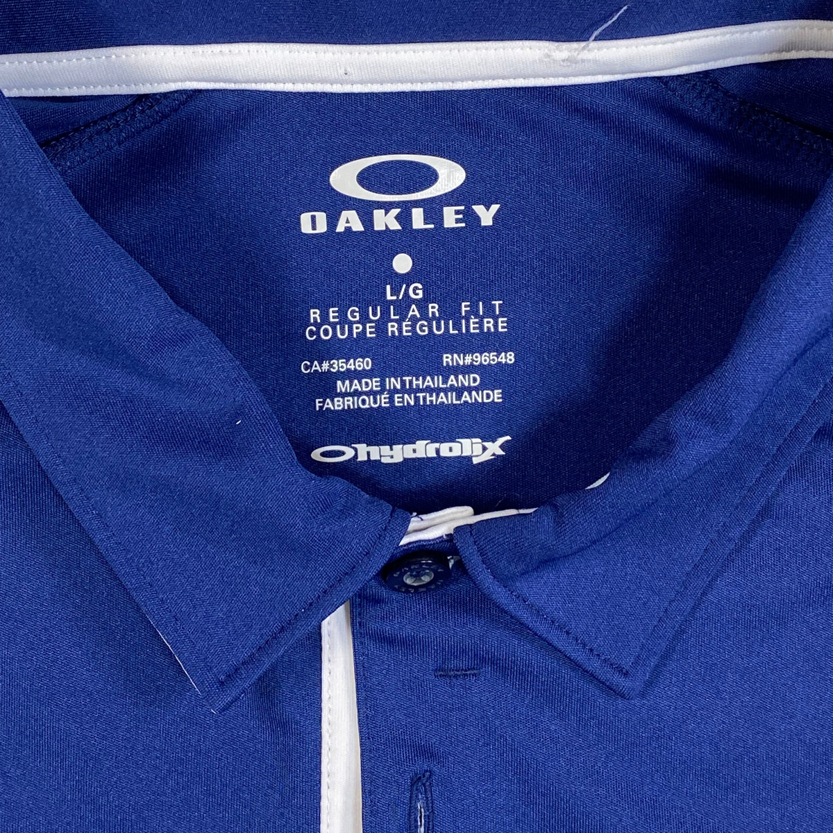 Digg It Thrift & Vintage Oakley Ohydrolix navy blue and white athletic golf polo shirt with size large neck label
