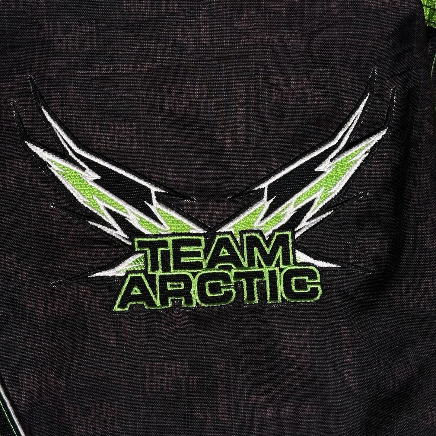 Digg It Thrift & Vintage Arctic Cat Team Arctic TriBalance snowmobile racing jacket with green and black embroidery.
