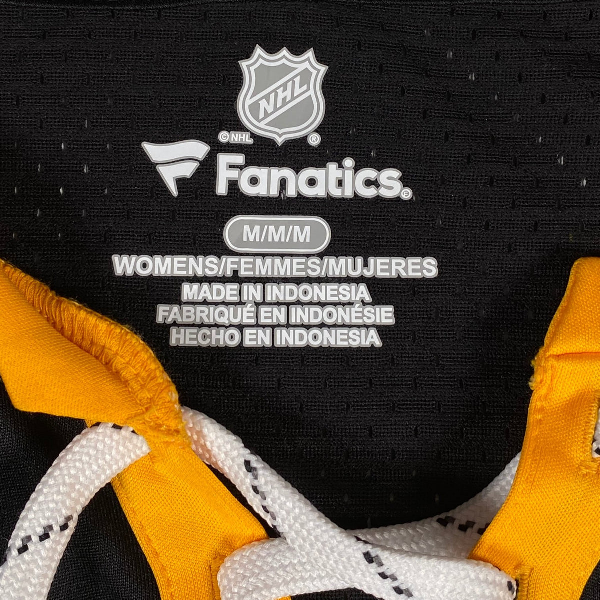 Digg It Thrift & Vintage Fanatics Boston Bruins NHL jersey size medium tag with black mesh and yellow lace-up detail