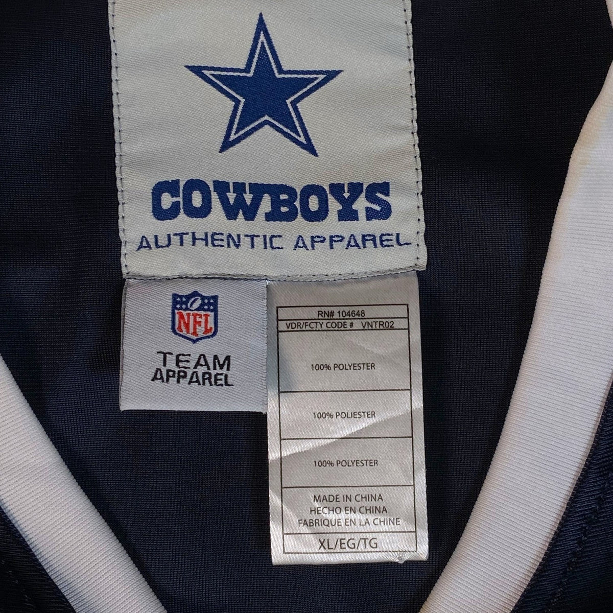 Digg It Thrift & Vintage Dallas Cowboys NFL authentic apparel jersey tag showing size XL and polyester material