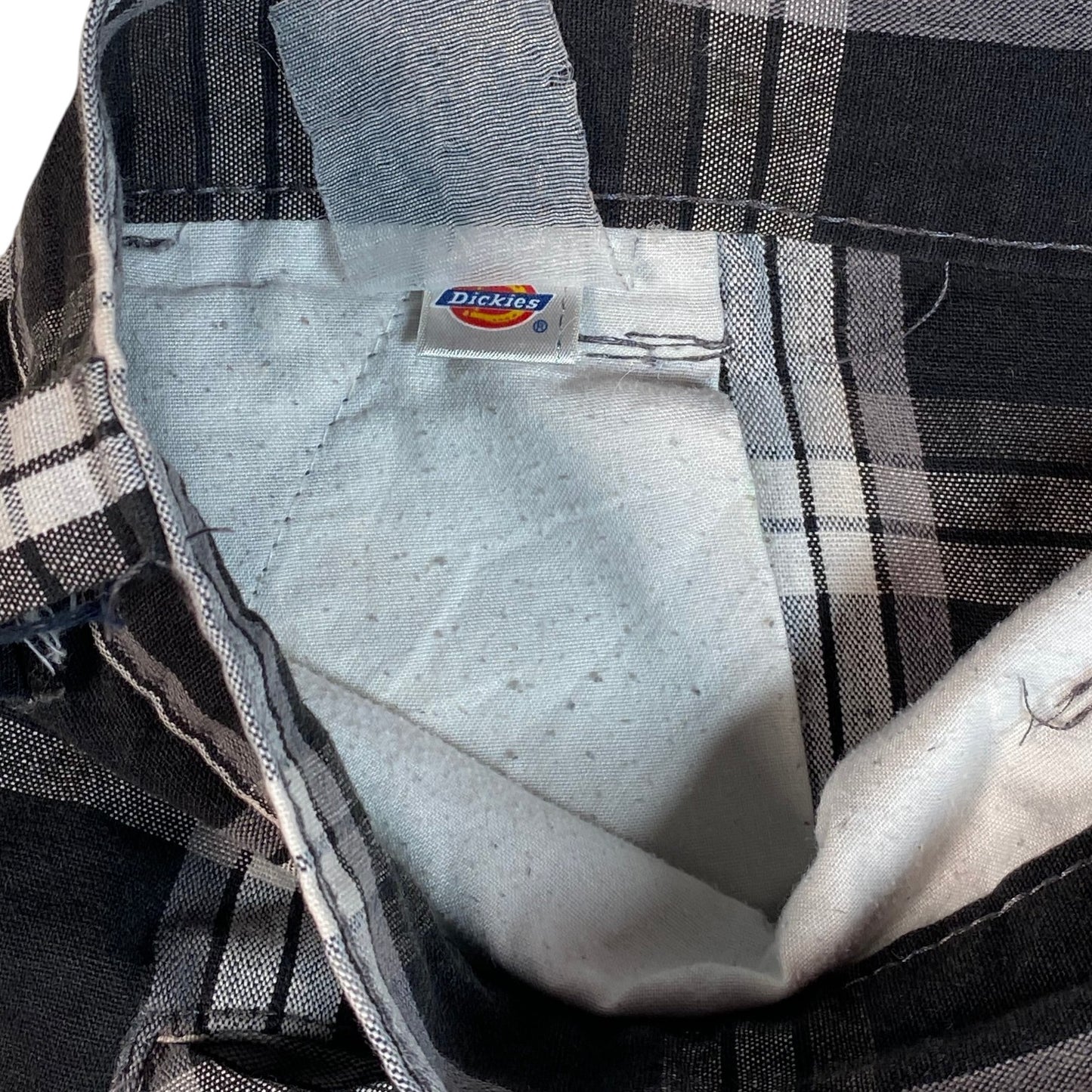 Digg It Thrift & Vintage Dickies black and white plaid shorts with interior brand label and size 38 tag