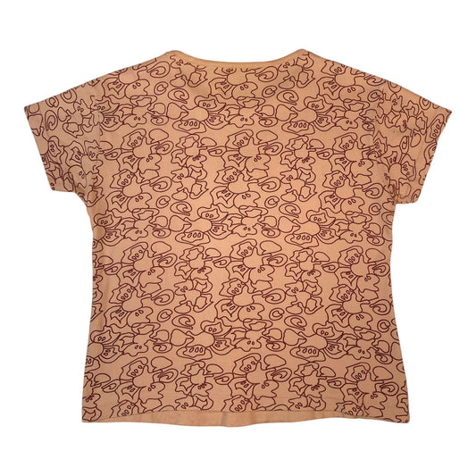 Back view of a Digg It Thrift & Vintage dusty pink short-sleeve top featuring an all-over dark brown medallion print.