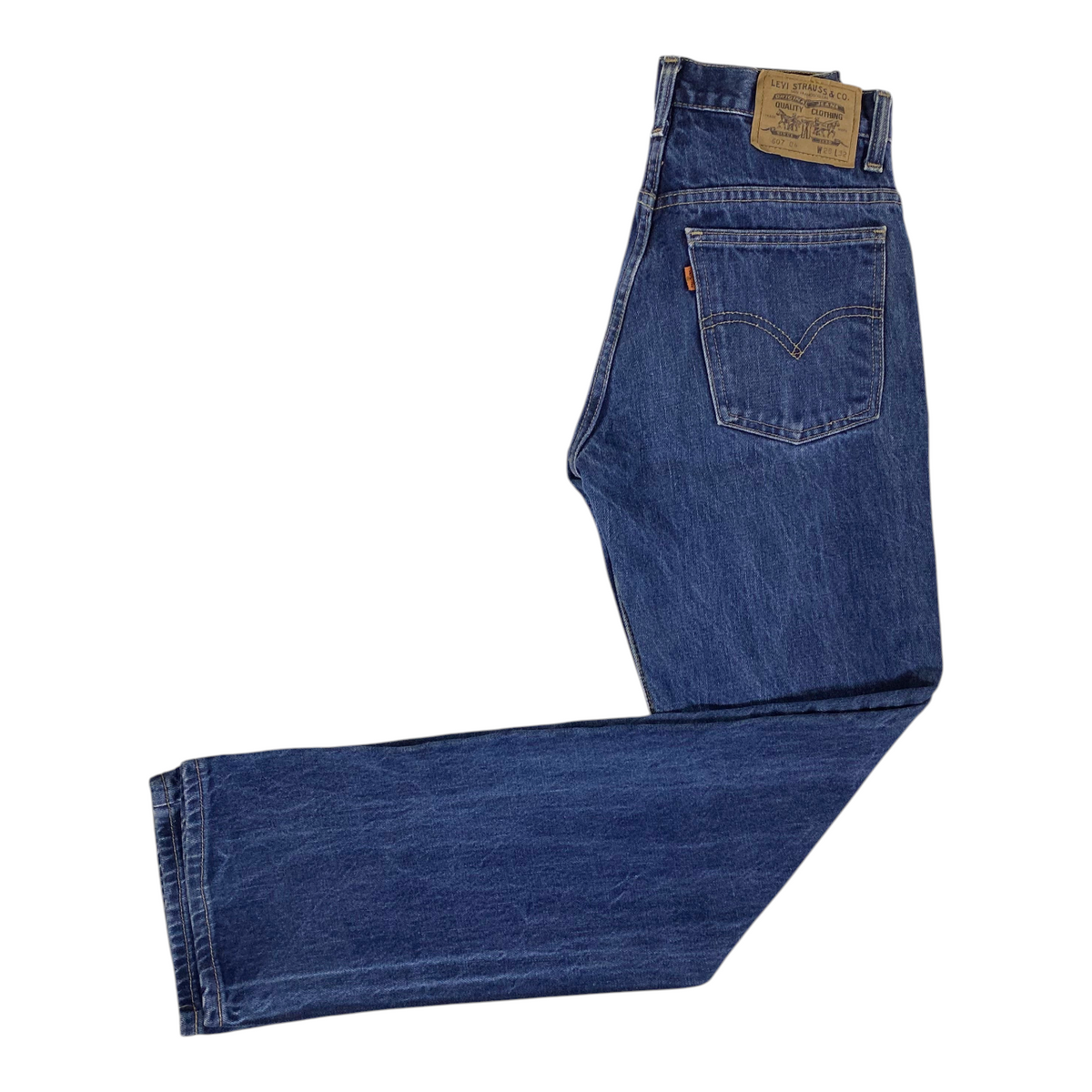 Digg It Thrift & Vintage Levi's 607 blue denim slim straight jeans with iconic orange tab and leather back patch.