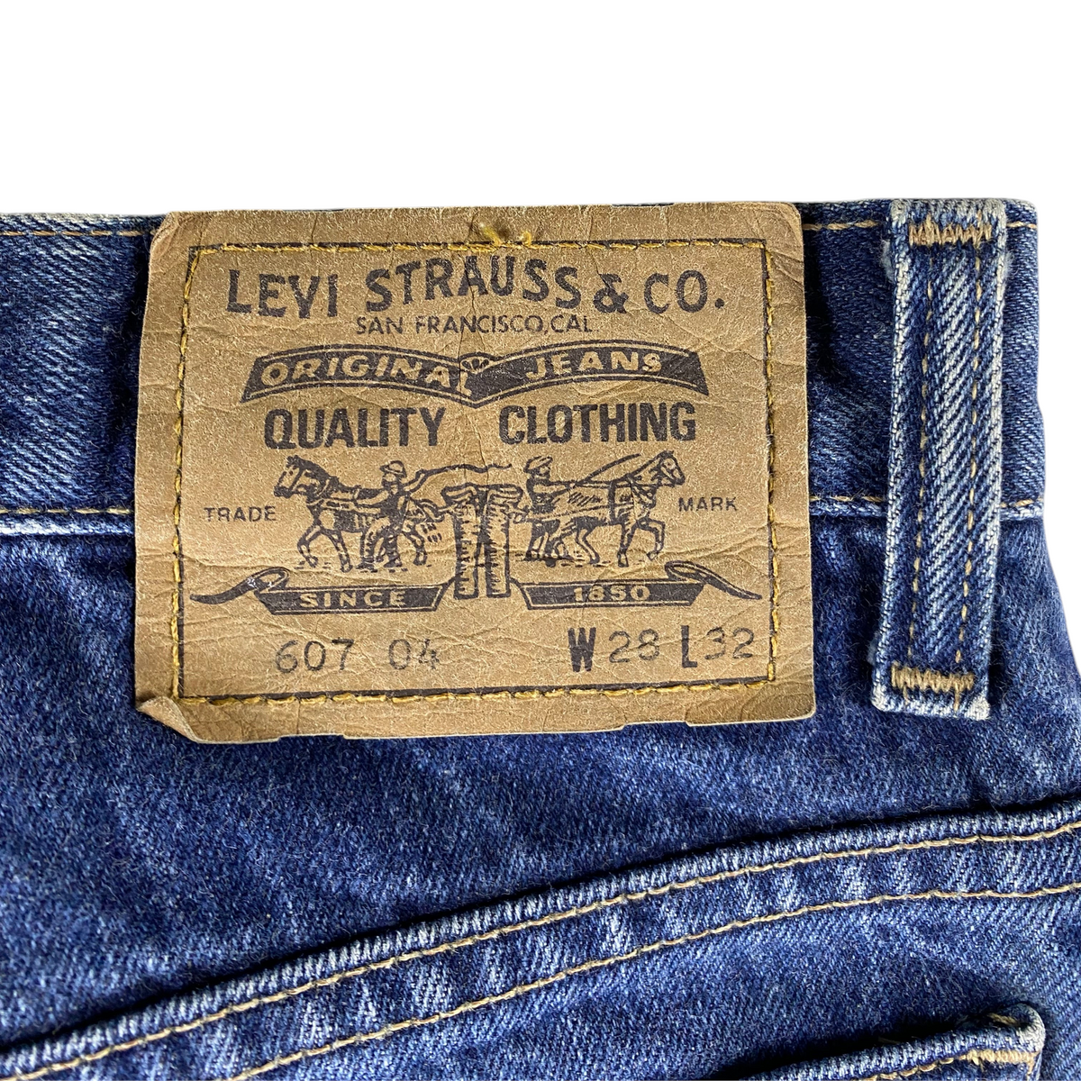 Digg It Thrift & Vintage Levi's 607 slim straight jeans brown leather waist patch with two horse brand logo