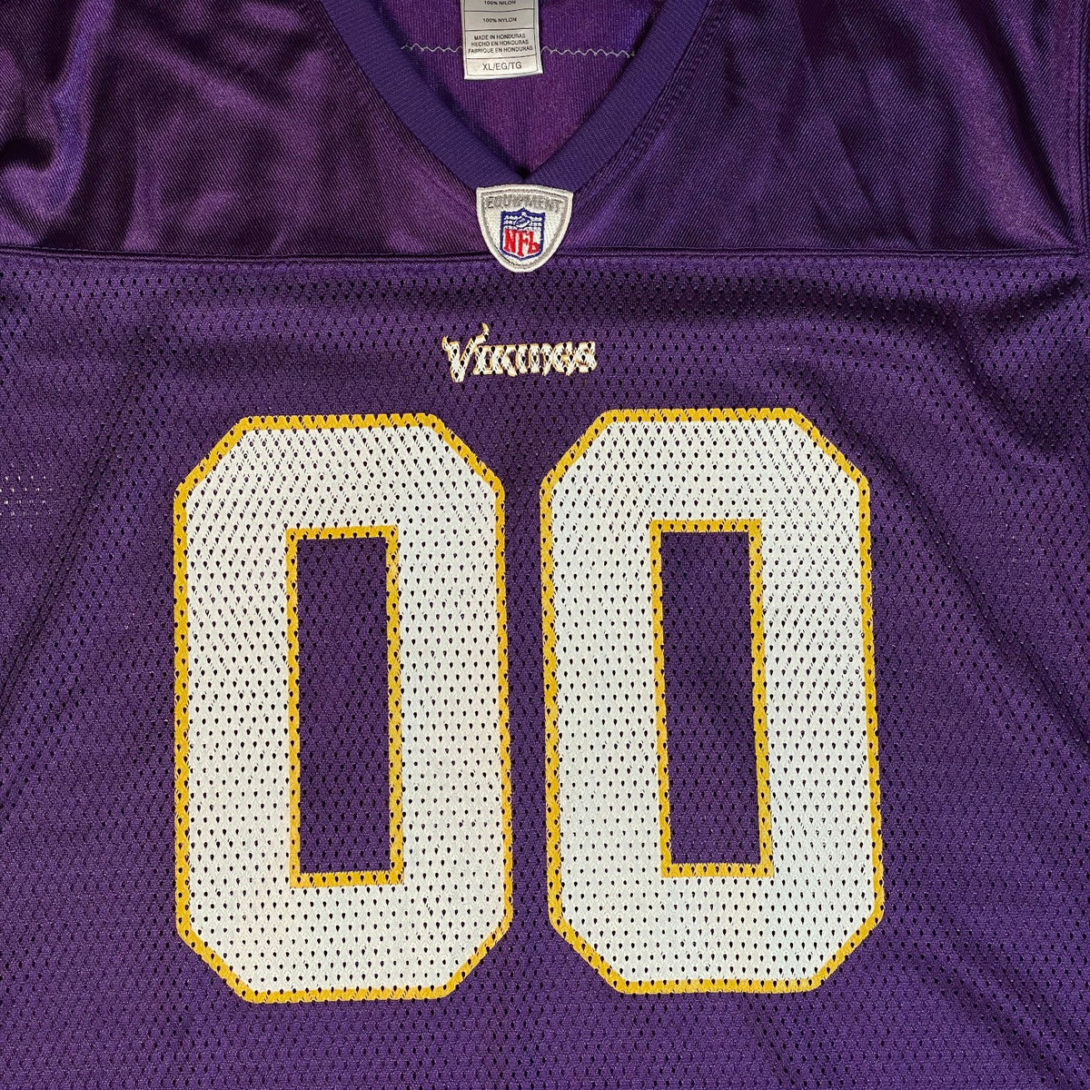 Digg It Thrift & Vintage purple Minnesota Vikings NFL jersey with white and yellow 00 numbers and mesh fabric