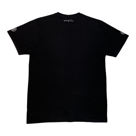 Back view of a black Stüssy x BAL Original x Hiroshi Nagai Yarigasaki Most Wanted T-Shirt from Digg It Thrift & Vintage