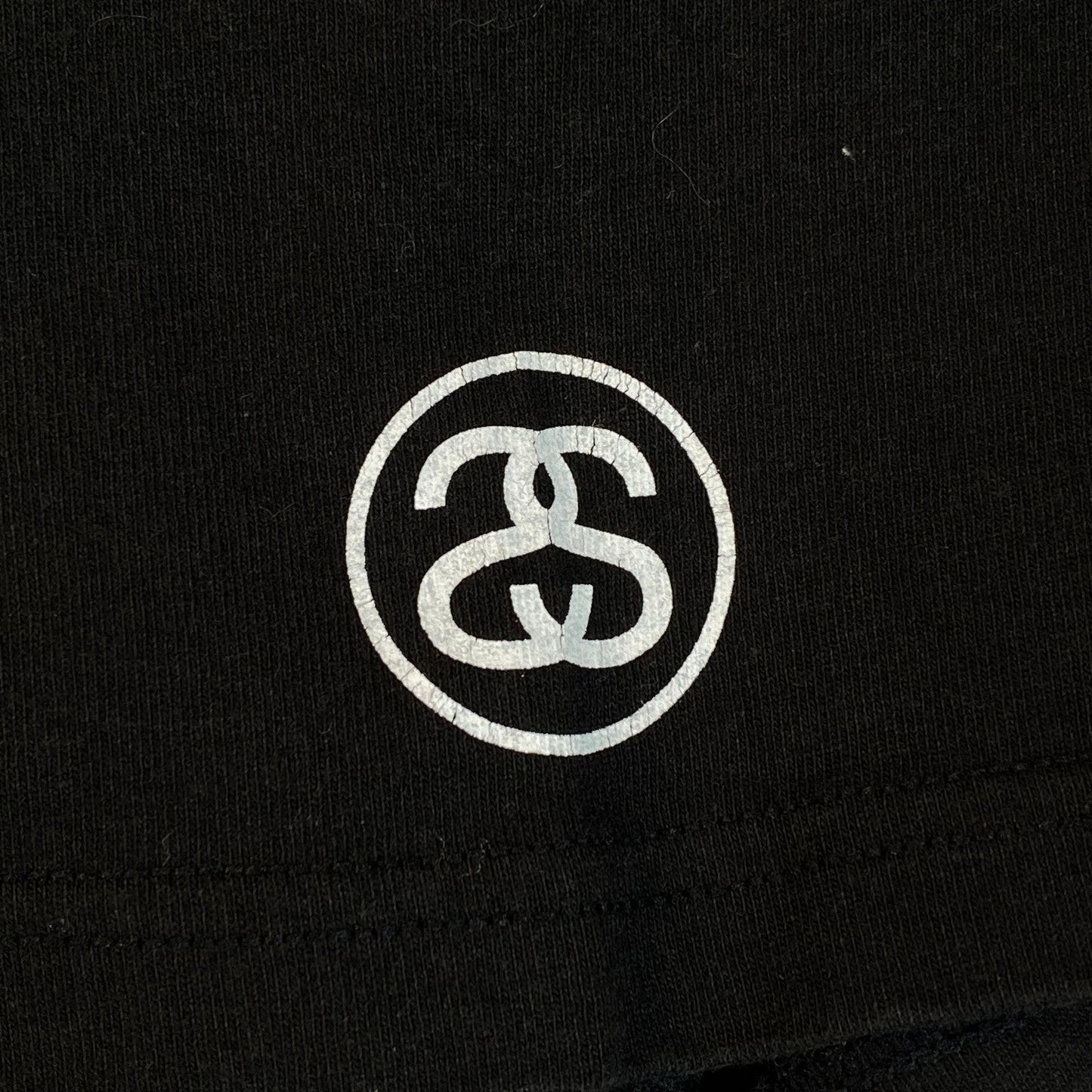 Digg It Thrift & Vintage black Stüssy graphic t-shirt with white circular logo detail