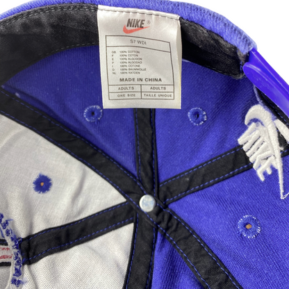 Digg It Thrift & Vintage Nike x Paris Saint-Germain snapback cap interior showing cotton tag and blue fabric