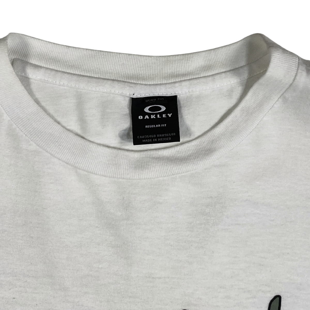 Digg It Thrift & Vintage white Oakley t-shirt with crew neck and internal brand label showing size 2XL