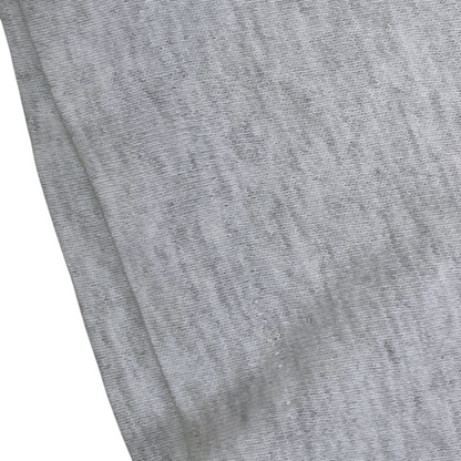 Close-up of grey heathered cotton fabric from a Digg It Thrift & Vintage Fruit of the Loom graphic t-shirt