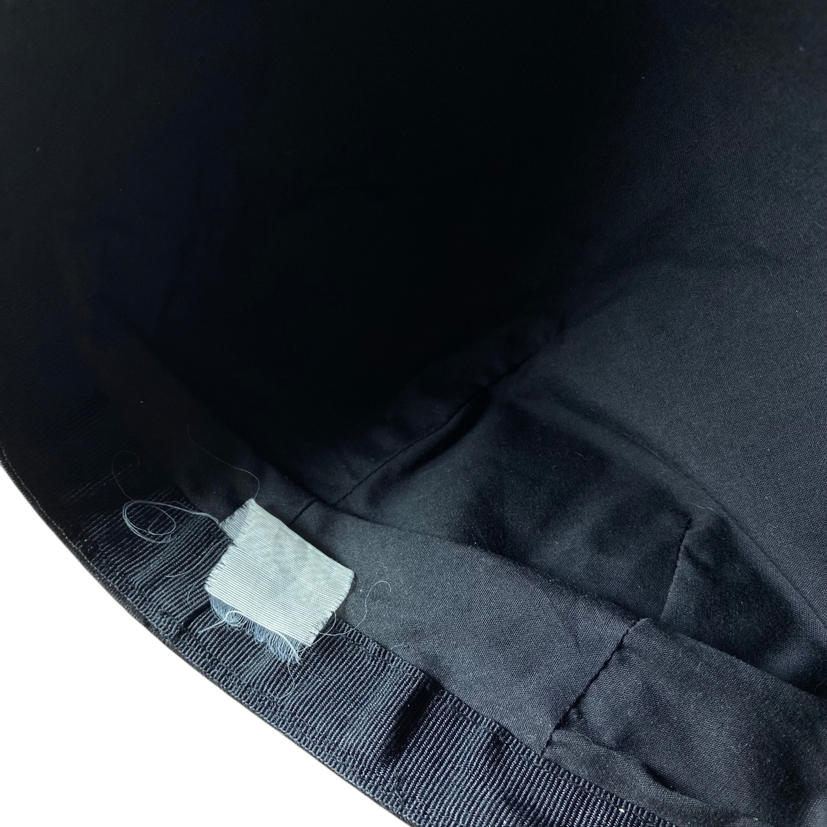 Interior view of a black Digg It Thrift & Vintage The Godfather Il Padrino flat cap showing the fabric lining