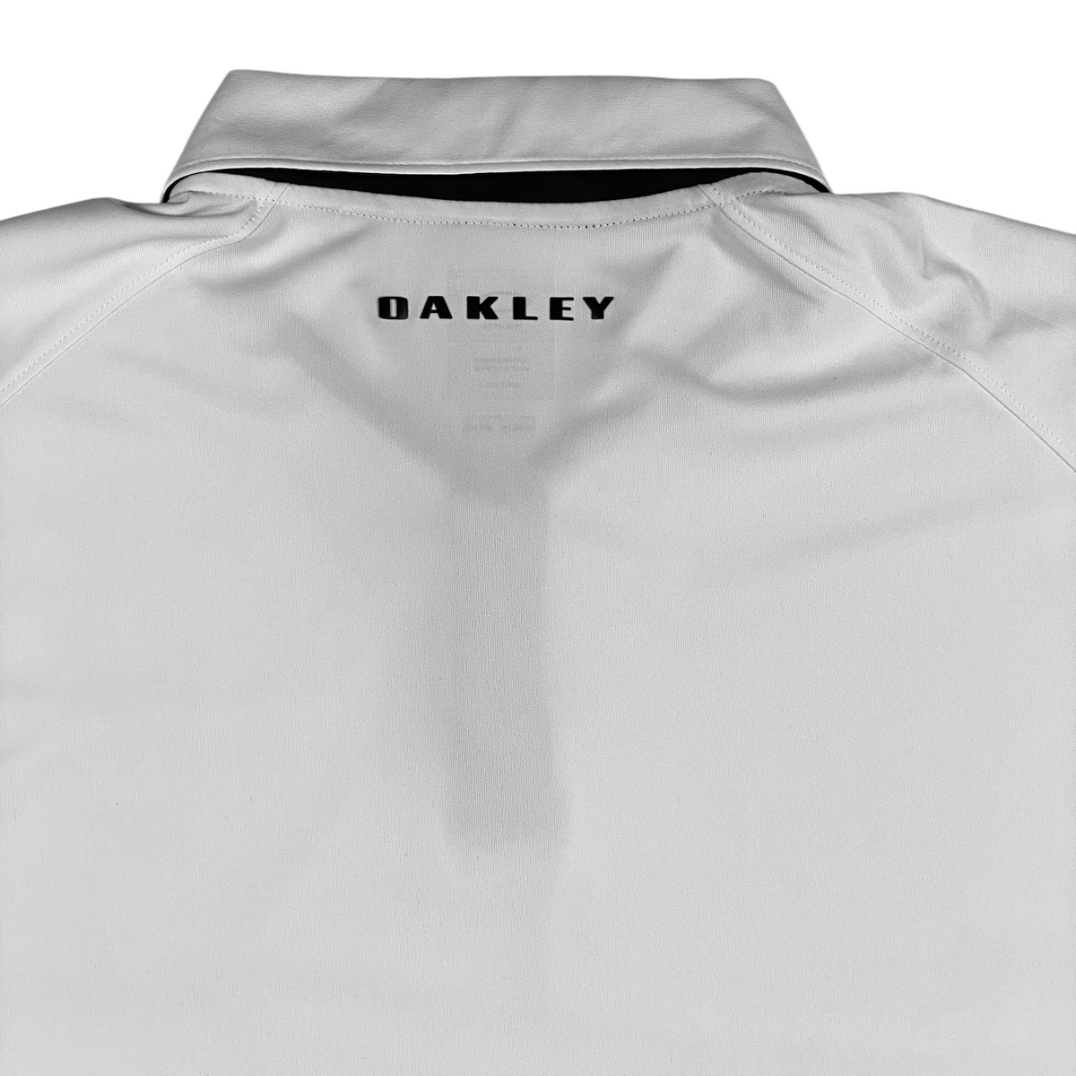 Digg It Thrift & Vintage white Oakley athletic golf polo shirt with black logo detail on the back collar