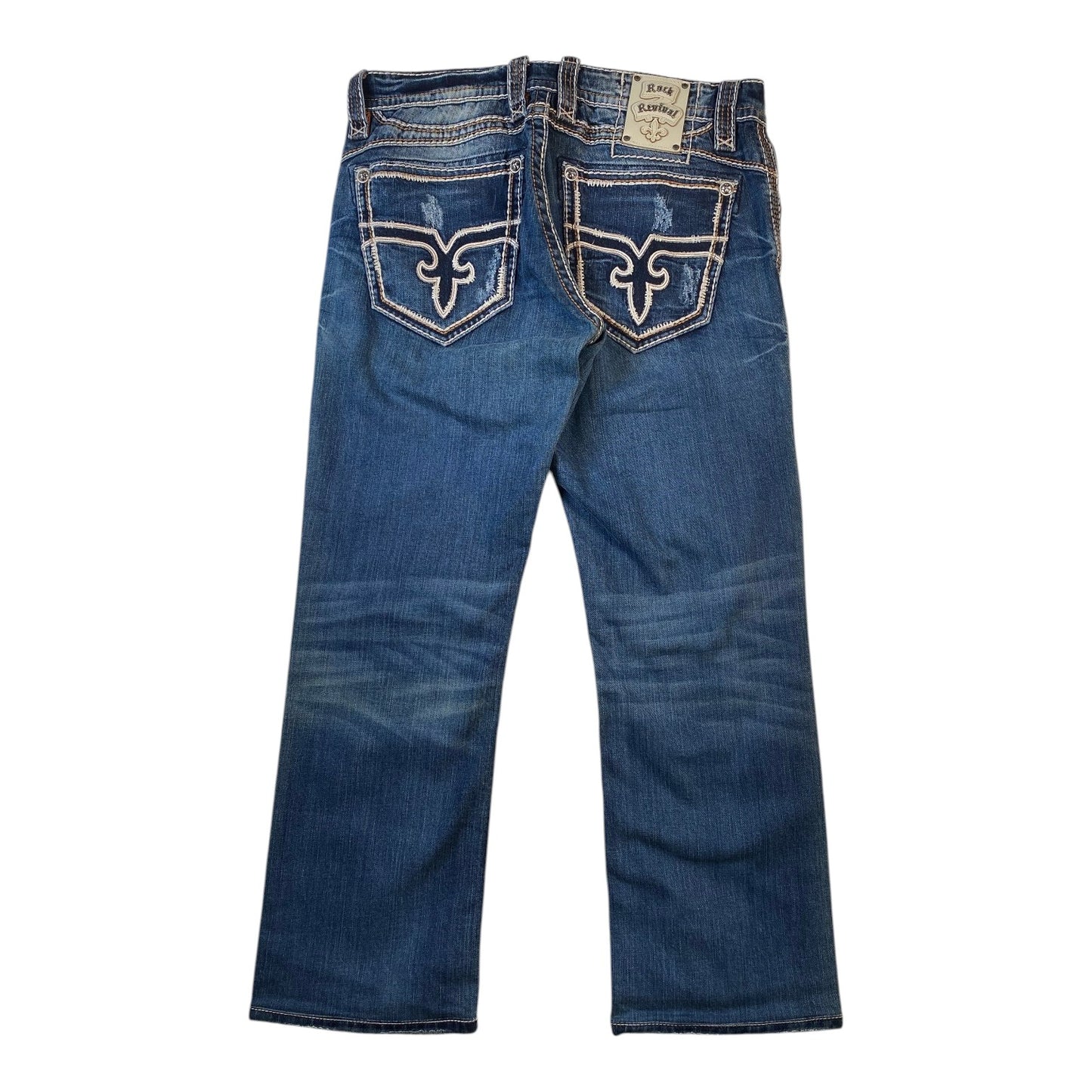 Rusty Brand bootcut jeans in medium blue denim, shown from the back with the signature embroidered horseshoe logo on the back pockets.