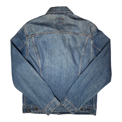 Back view of a vintage blue denim Levi's Trucker Jacket from Digg It Thrift & Vintage, size XL fitting like a Medium.