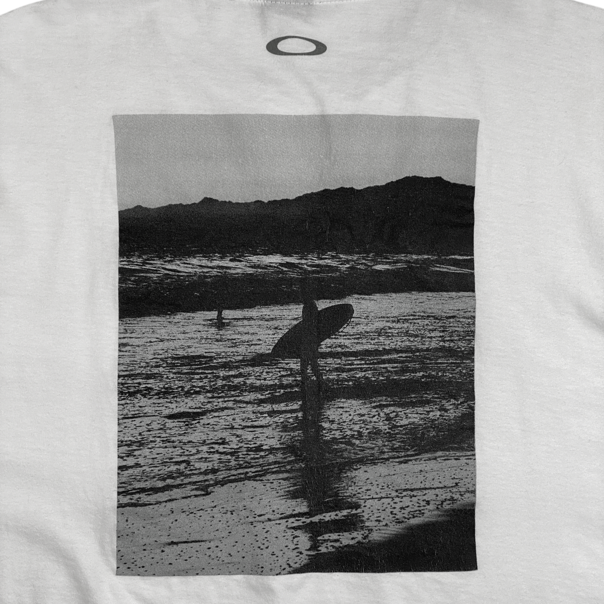 Digg It Thrift & Vintage white t-shirt featuring a black and white photographic print of a surfer on the beach
