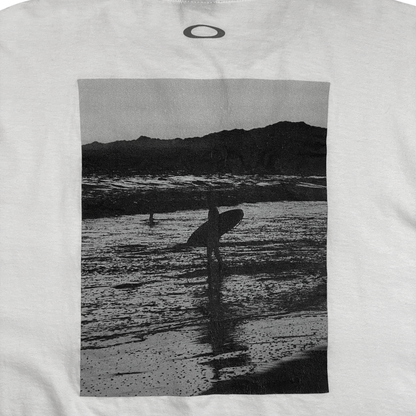 Digg It Thrift & Vintage white t-shirt featuring a black and white photographic print of a surfer on the beach
