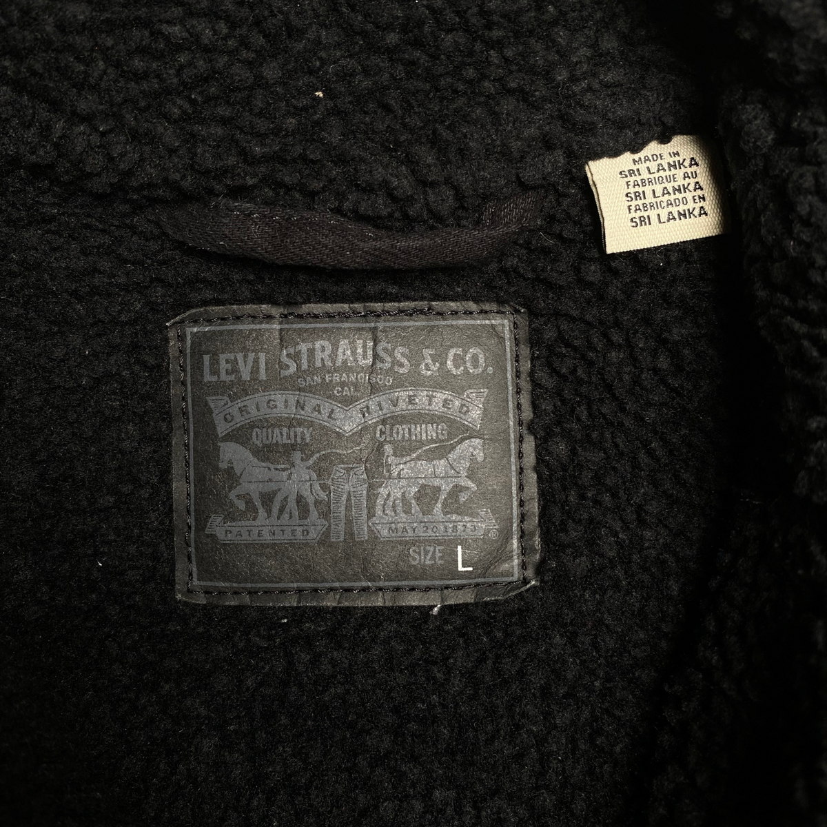 Digg It Thrift & Vintage black Levi's denim jacket interior with sherpa lining and size large label
