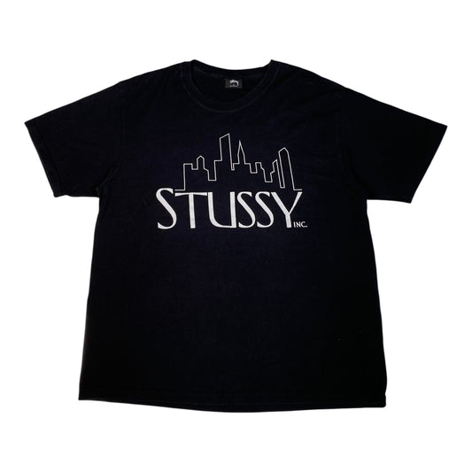 A plain black short-sleeve crewneck t-shirt shown from the back, laid flat against a solid white background.