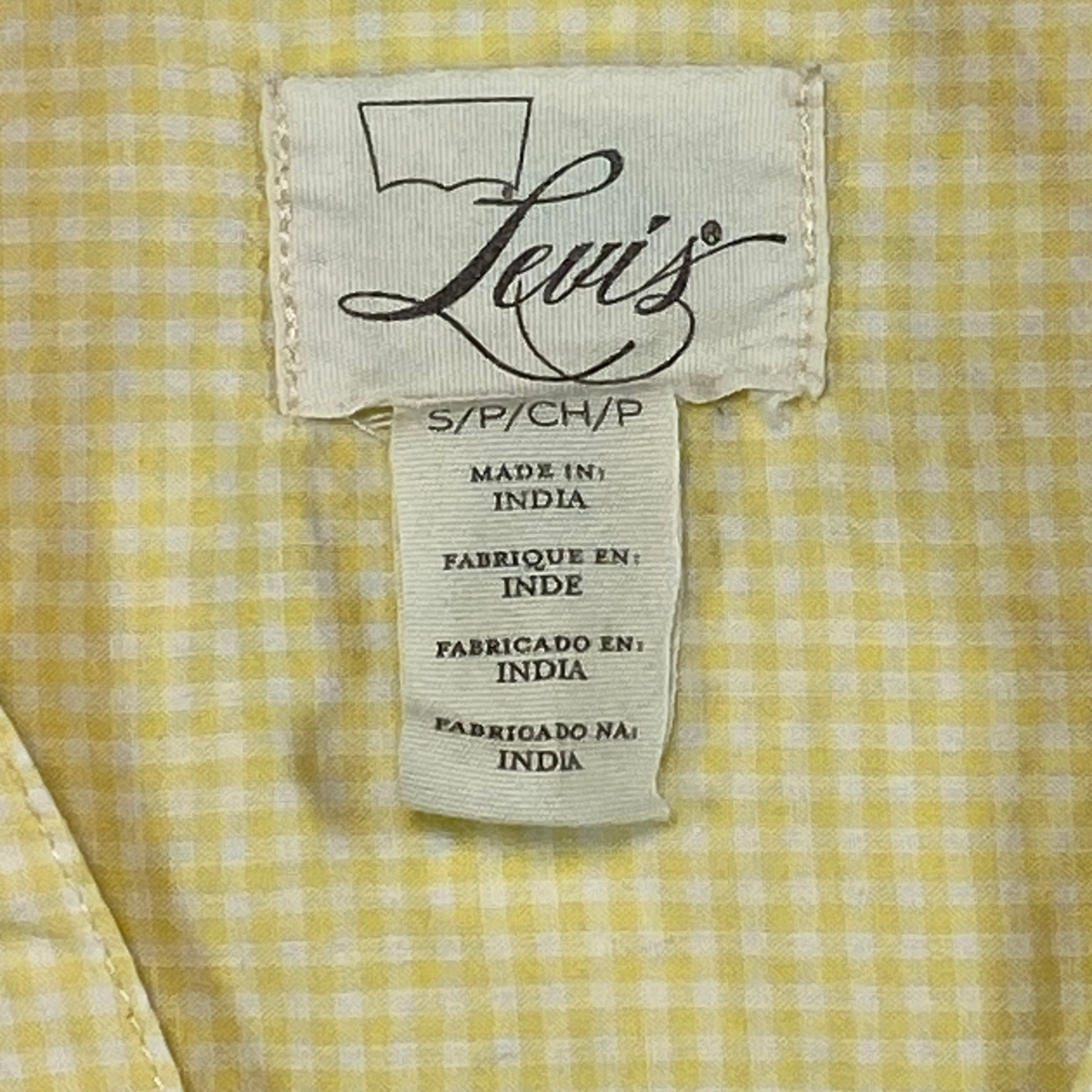 Digg It Thrift & Vintage Levi's yellow gingham shirt label showing size small, made in India.