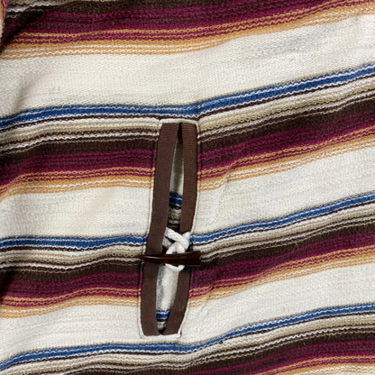 Digg It Thrift & Vintage Stüssy vintage Baja hoodie featuring multi-colored stripes and a wooden bead toggle closure.