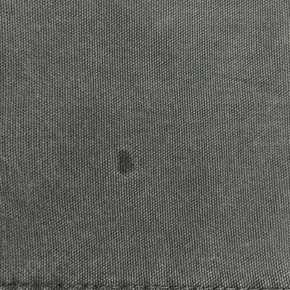 Close-up of dark green fabric on Digg It Thrift & Vintage Dickies pants showing texture and a small spot
