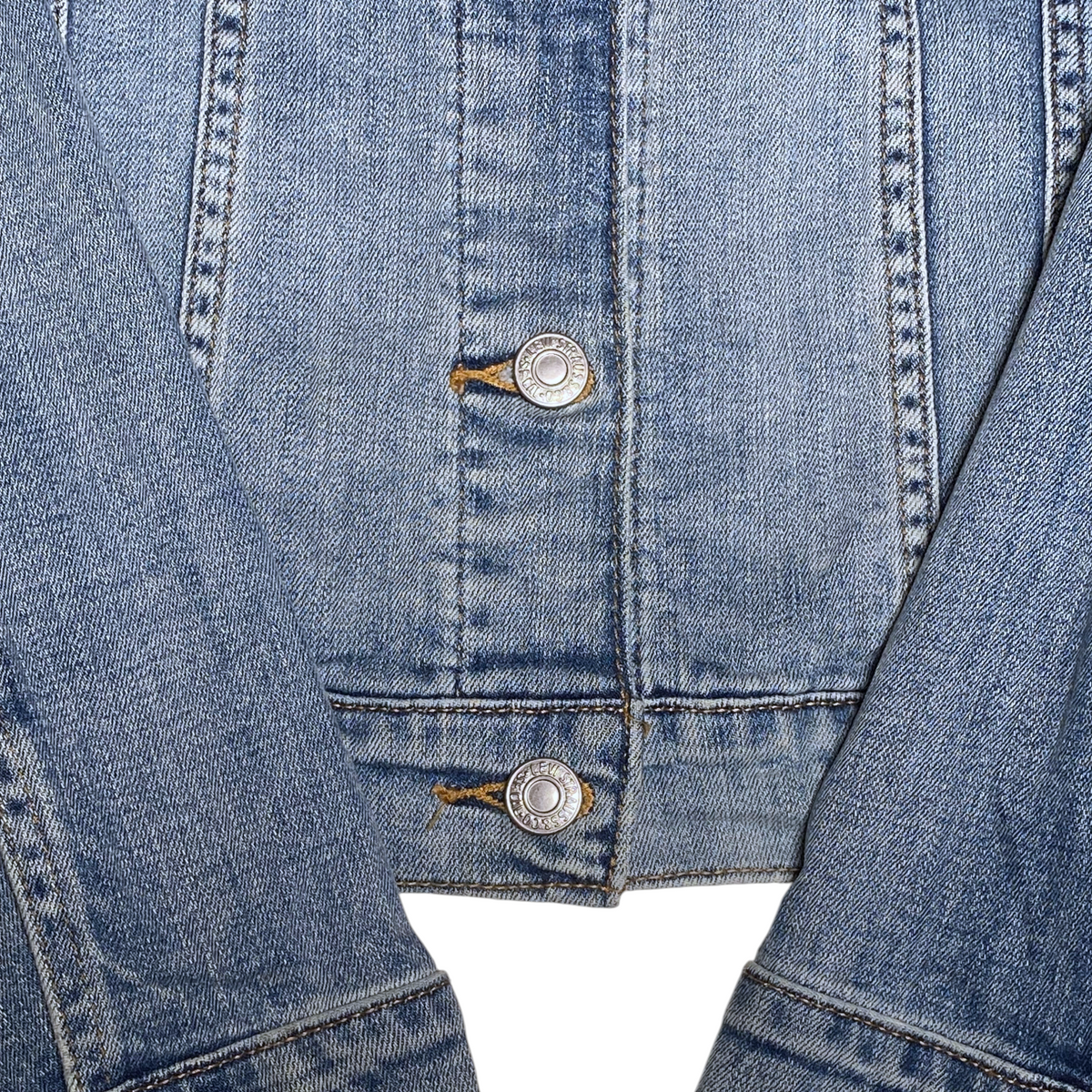 Digg It Thrift & Vintage Levi's light wash denim trucker jacket with branded metal buttons and stitched cuffs