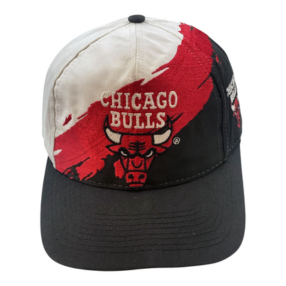 Digg It Thrift & Vintage 90s Chicago Bulls wool snapback cap with black, white, and red splash graphic embroidery.