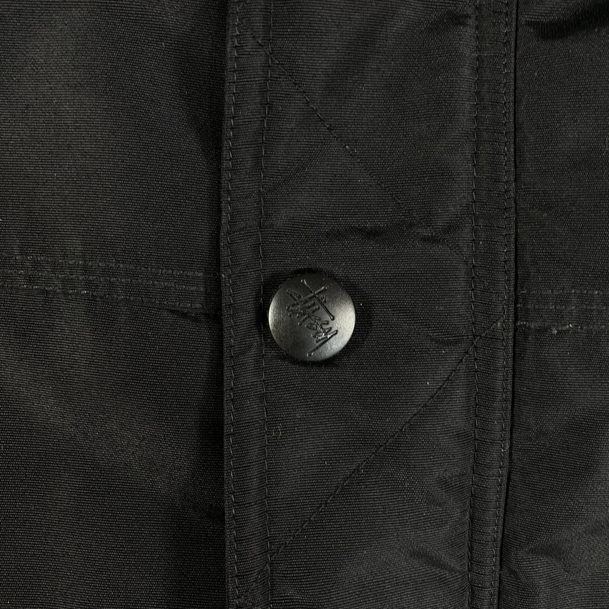 Digg It Thrift & Vintage black quilted Stüssy workwear jacket with branded snap button detail