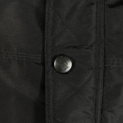 Digg It Thrift & Vintage black quilted Stüssy workwear jacket with branded snap button detail