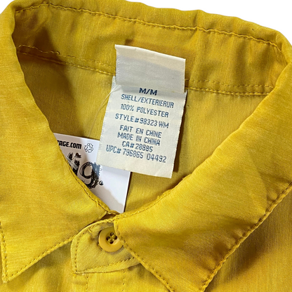 Digg It Thrift & Vintage yellow 725 Originals shirt tag showing 100 percent polyester material and medium size