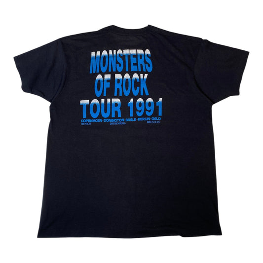 A black short-sleeve t-shirt showing the back side with a large blue graphic print that reads 'MONSTERS OF ROCK TOUR 1991' in stacked text.