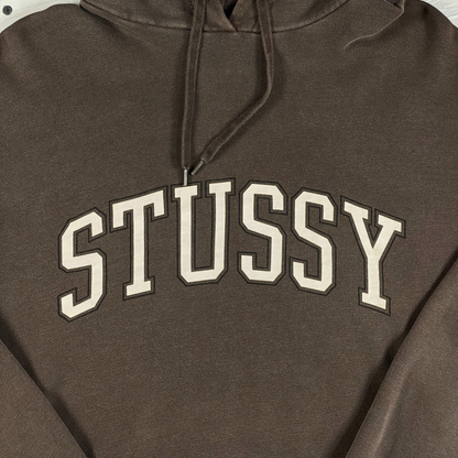 Digg It Thrift & Vintage faded mocha brown Stüssy hoodie featuring a cream collegiate arch logo on the chest