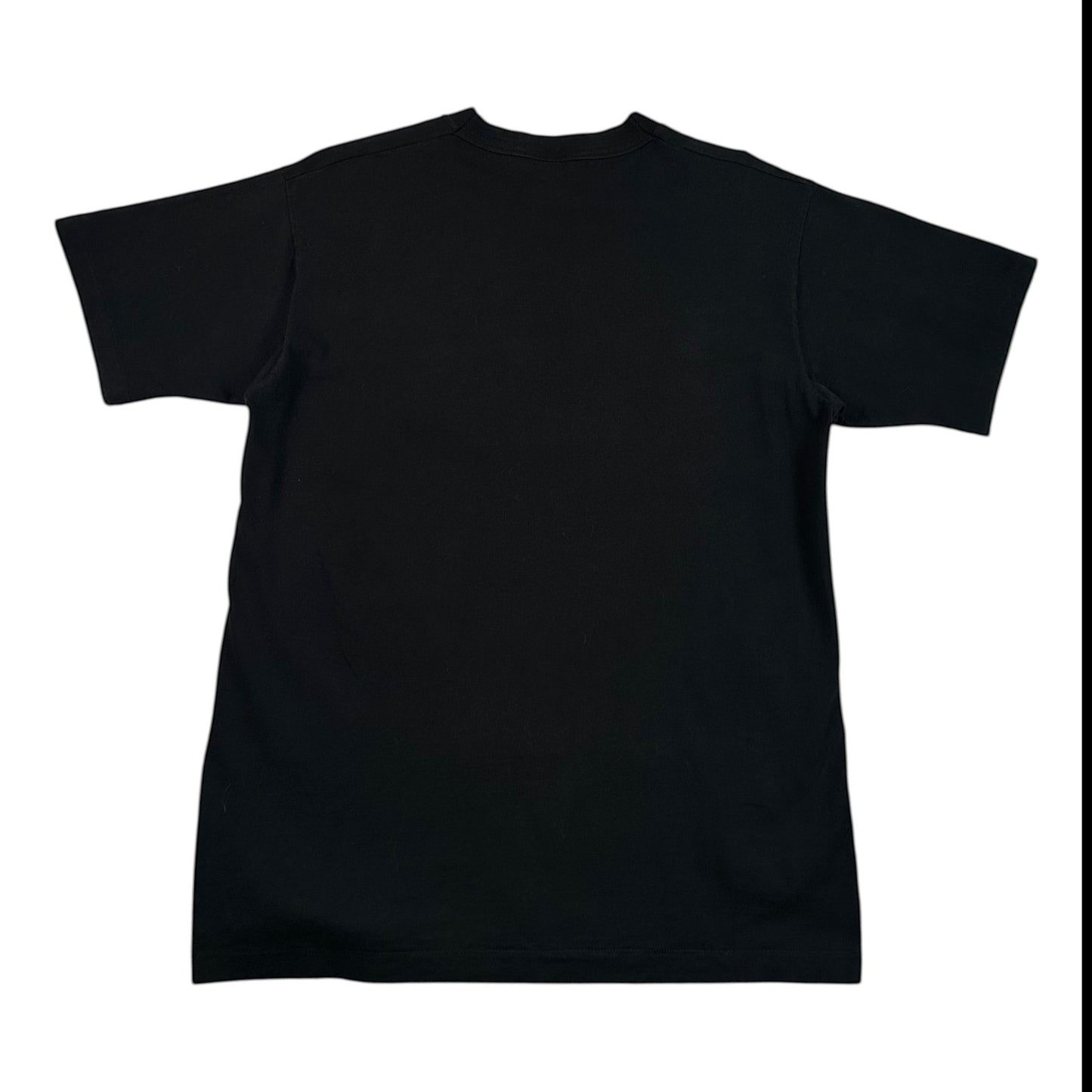 A black short-sleeve crewneck t-shirt laid flat on a white surface covered with clear plastic wrap.