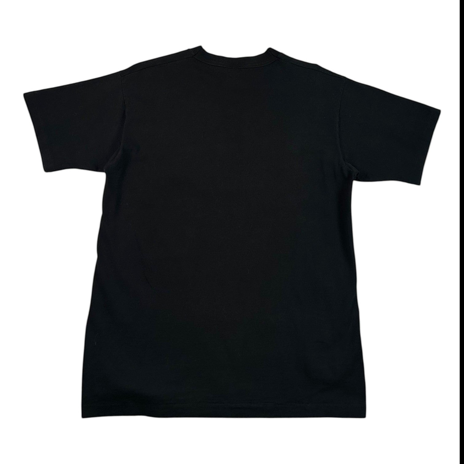 A black short-sleeve crewneck t-shirt laid flat on a white surface covered with clear plastic wrap.