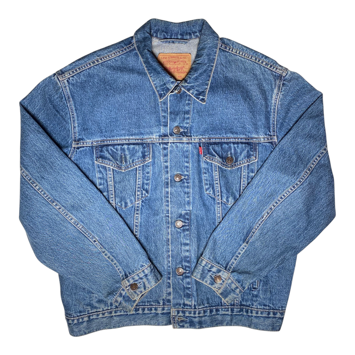 Digg It Thrift & Vintage blue denim Levi's trucker jacket with button-up front and chest pockets