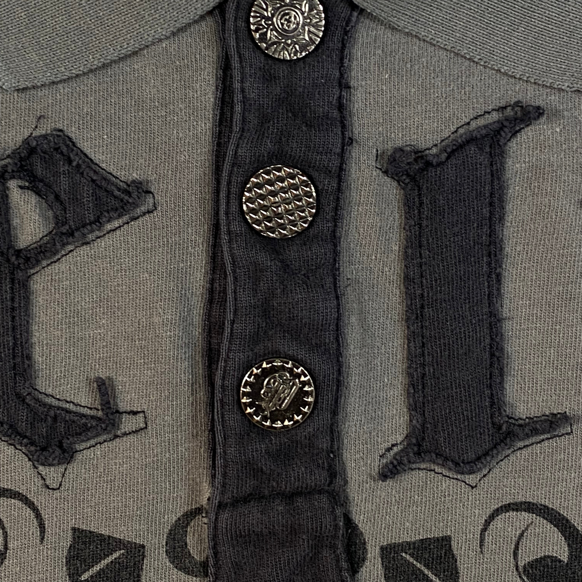 Digg It Thrift & Vintage grey Pelle Pelle Legend Reborn polo shirt with gothic lettering and ornate metal buttons