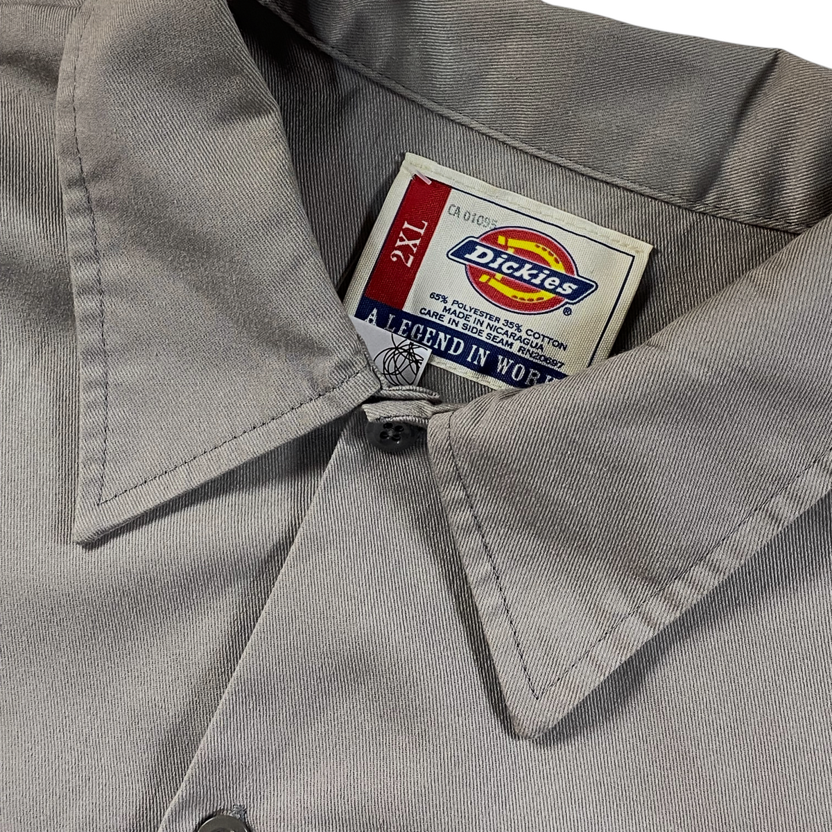Digg It Thrift & Vintage Dickies khaki short-sleeve work shirt with 2XL size tag and polyester-cotton blend label