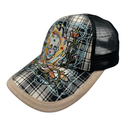 Digg It Thrift & Vintage Y2K Ed Hardy trucker cap with rhinestone skull embroidery, plaid brim, and black mesh back.