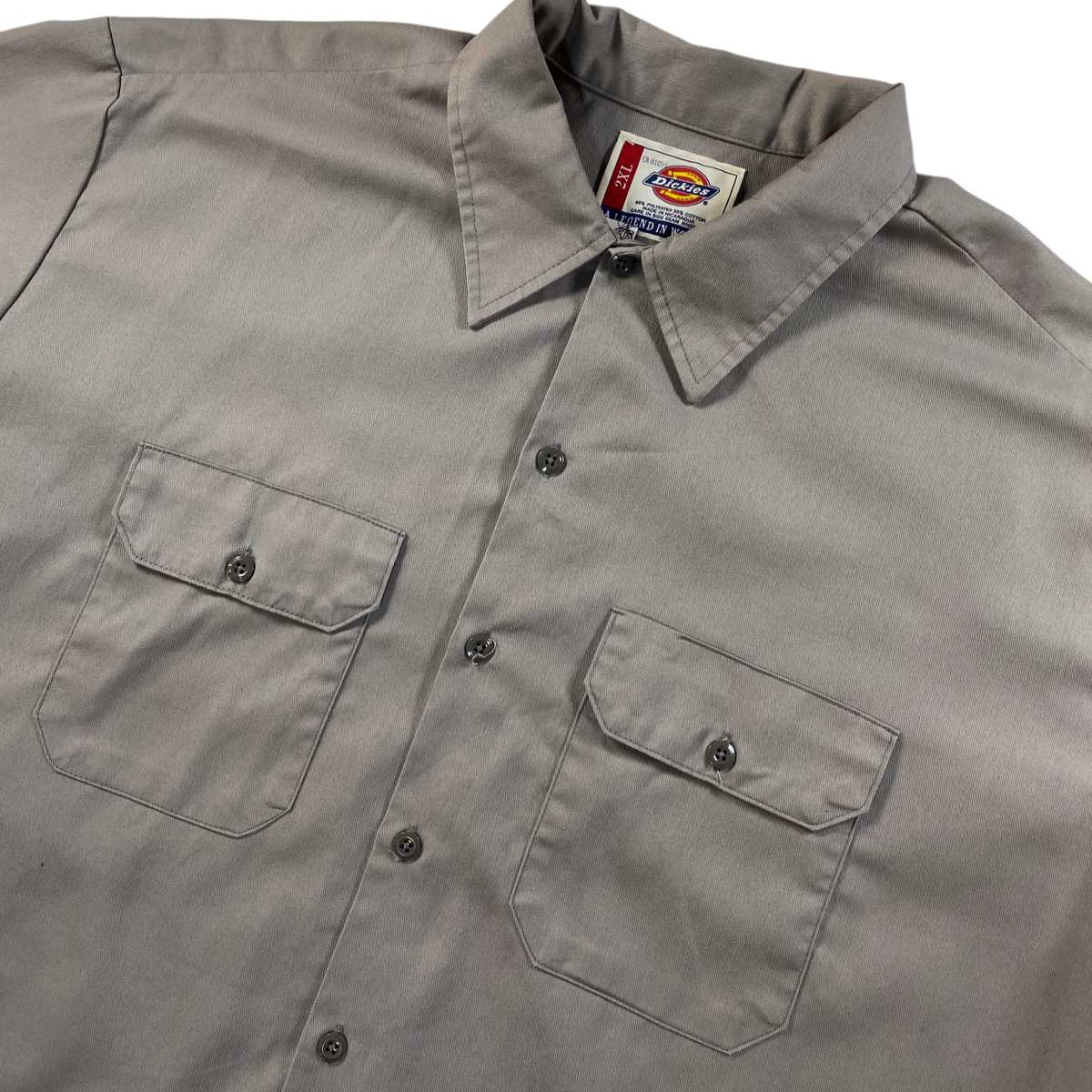Digg It Thrift & Vintage khaki Dickies short-sleeve work shirt with dual button-flap chest pockets and collar