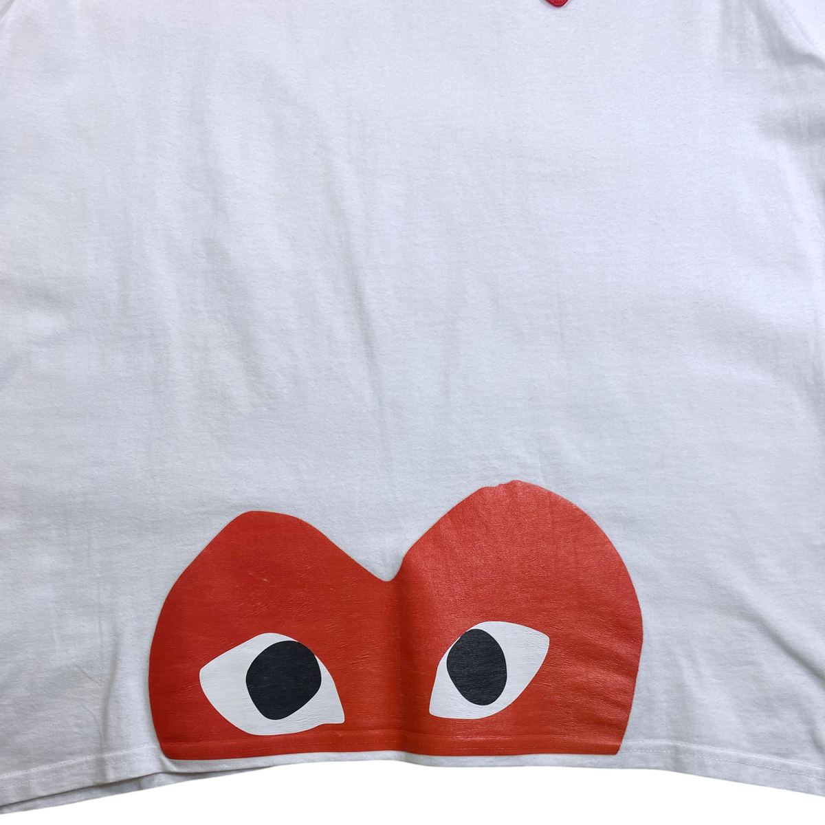 Digg It Thrift & Vintage white cotton t-shirt featuring a large red heart graphic with eyes at the hem