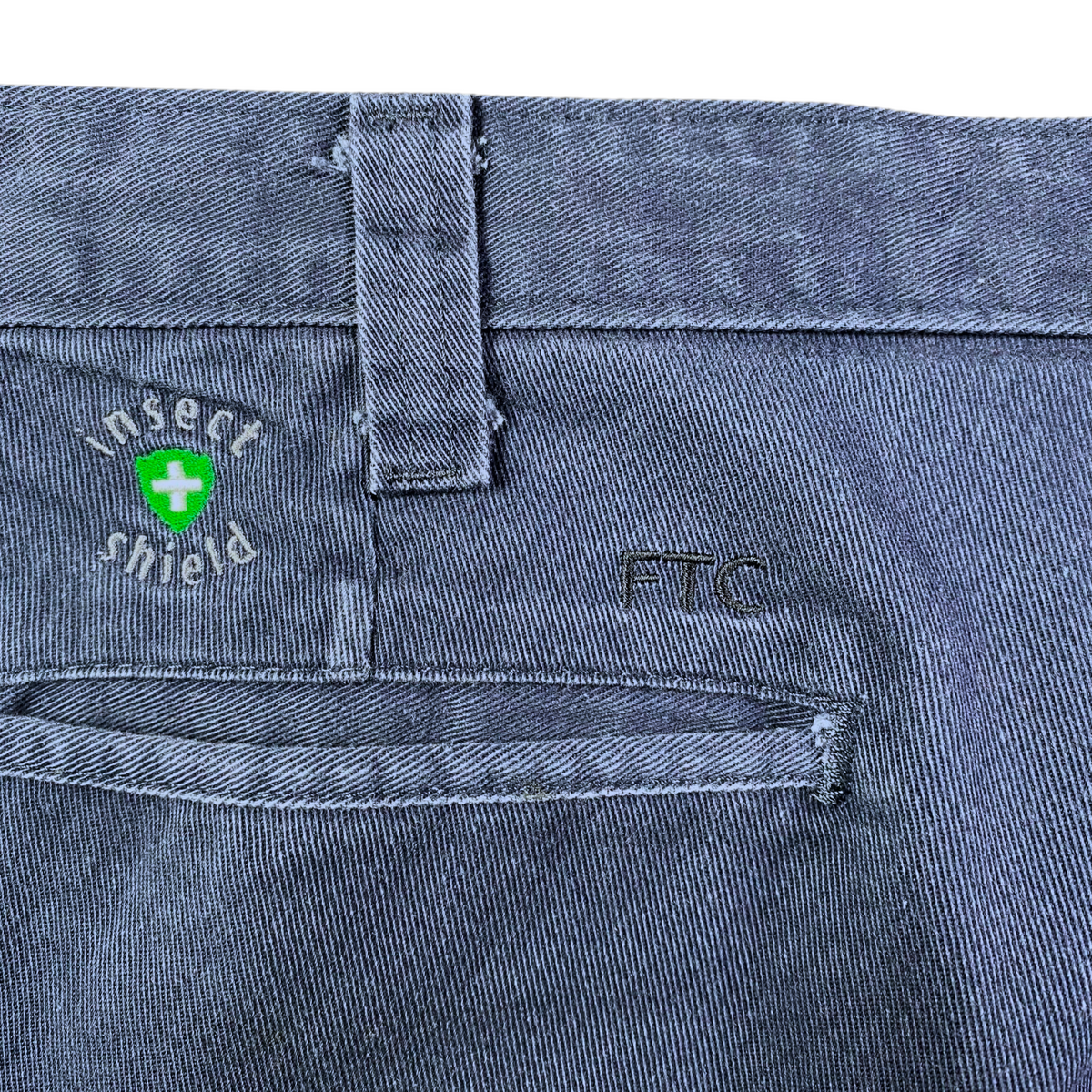 Digg It Thrift & Vintage navy Dickies work pants featuring Insect Shield technology and FTC embroidery on the pocket.