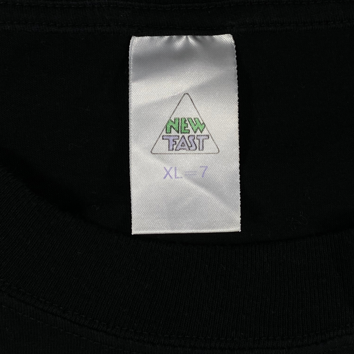 Digg It Thrift & Vintage black t-shirt interior neck label with New Fast branding and size XL tag