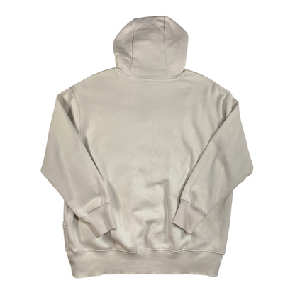 Back view of a cream Nike oversized pullover hoodie from Digg It Thrift & Vintage with ribbed cuffs and hem.