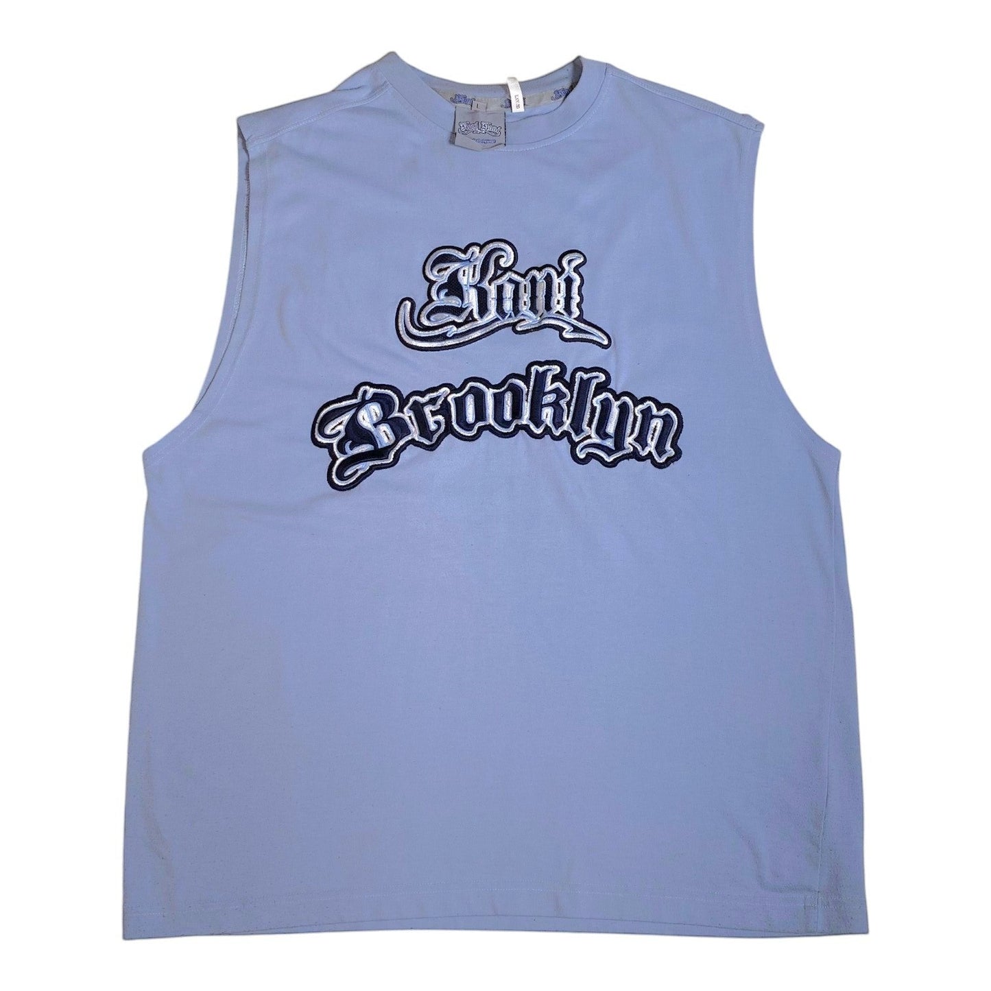 A light blue sleeveless muscle tank top featuring a stylized 'Now Brooklyn' graphic in black and white gothic font across the chest, displayed flat against a white background.