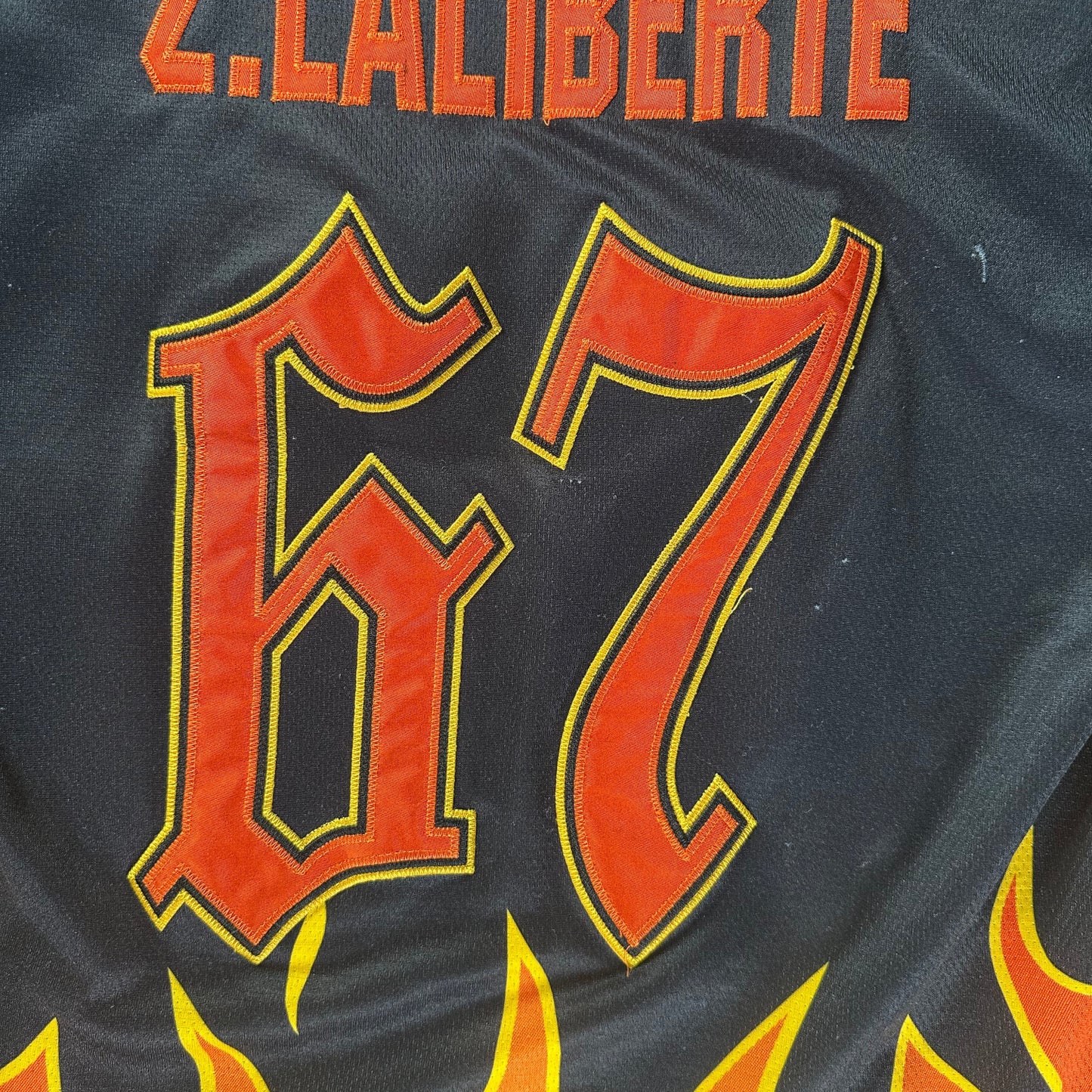Projoy Laliberté Flame Graphic Black and Orange Hockey Jersey
