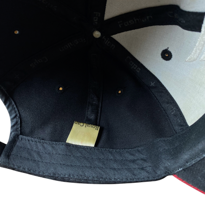 Interior view of a Digg It Thrift & Vintage Honda baseball cap showing black fabric, branded tape, and a label.