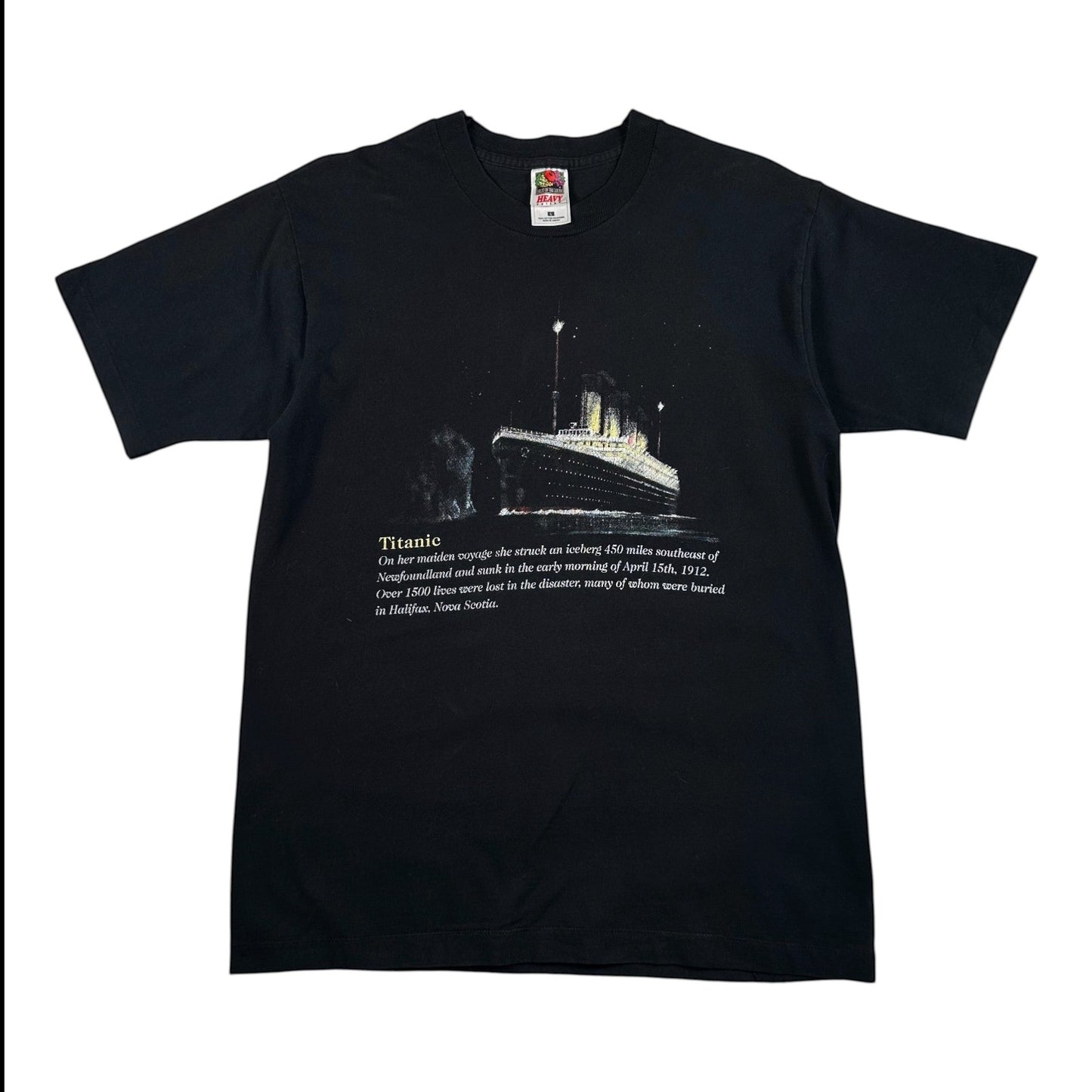 A black short-sleeve crewneck t-shirt featuring a graphic print of the Titanic on the front with a white text description below it, displayed flat against a white background.